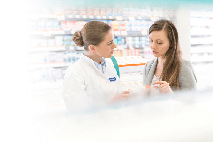 What Causes BV A woman asking a pharmacist about Fleurstat BV treatment gel